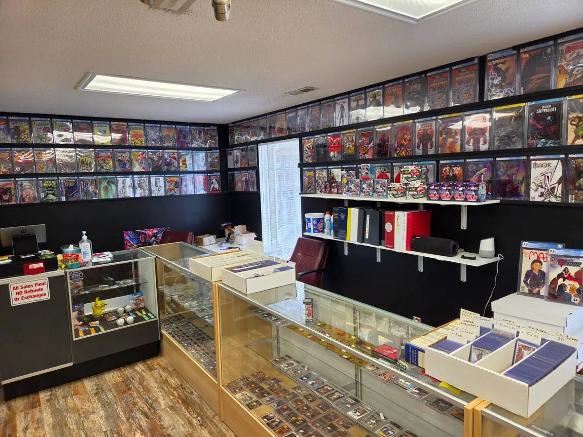 Front counter with card cases, player boxes and a wall of graded comics
